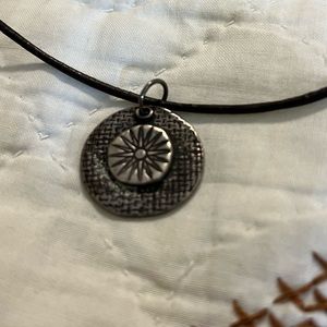 Leather and pewter pendant